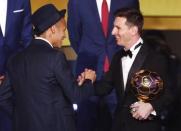 FC Barcelona's Lionel Messi of Argentina (R) shakes hand with FC Barcelona's Neymar'of Brazil after receiving the World Player of the Year award during the FIFA Ballon d'Or 2015 ceremony in Zurich, Switzerland, January 11, 2016. REUTERS/Arnd Wiegmann