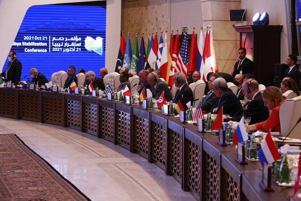 Libyan Prime Minister Abdul Hamid Dbeibah hosts an international conference with western, regional and United Nations representatives aimed at resolving Libya's thorniest issues ahead of general elections planned for December, at the Coronthia Hotel in Tripoli, Libya, Thursday, Oct. 21, 2021. On the table are several contentious issues, including maintaining the country's ceasefire, uniting the many armed groups, and the withdrawal of foreign fighters. (AP Photo/Yousef Murad)