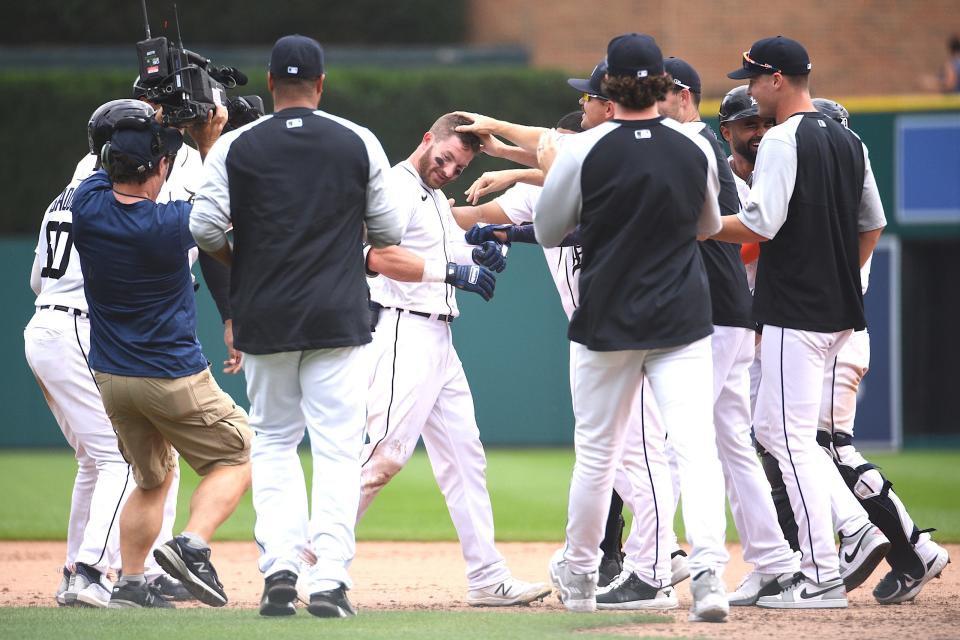 Tigers left fielder Robbie Grossman celebrates with teammates after the 8-7 win over the Rays in 11 innings on Sunday, Sept. 12, 2021, at Comerica Park.