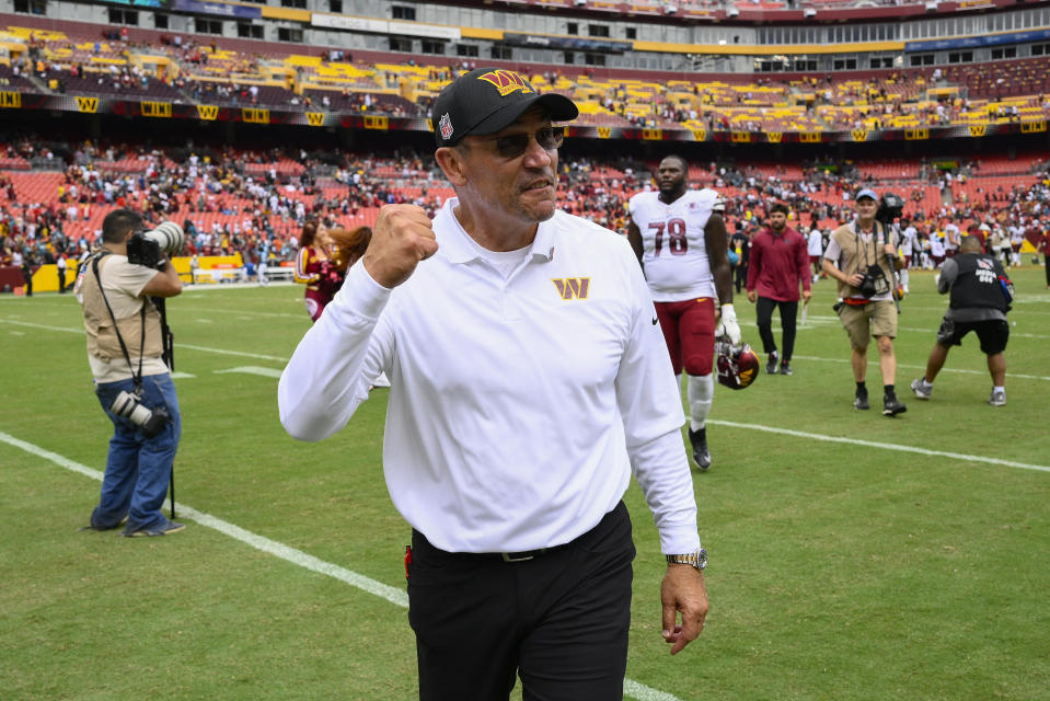 Washington Commanders head coach Ron Rivera pumps his fist as he walks off the field following the end of an NFL football game against the Jacksonville Jaguars, Sunday, Sept. 11, 2022, in Landover, Md. Washington on 28-22. (AP Photo/Nick Wass)