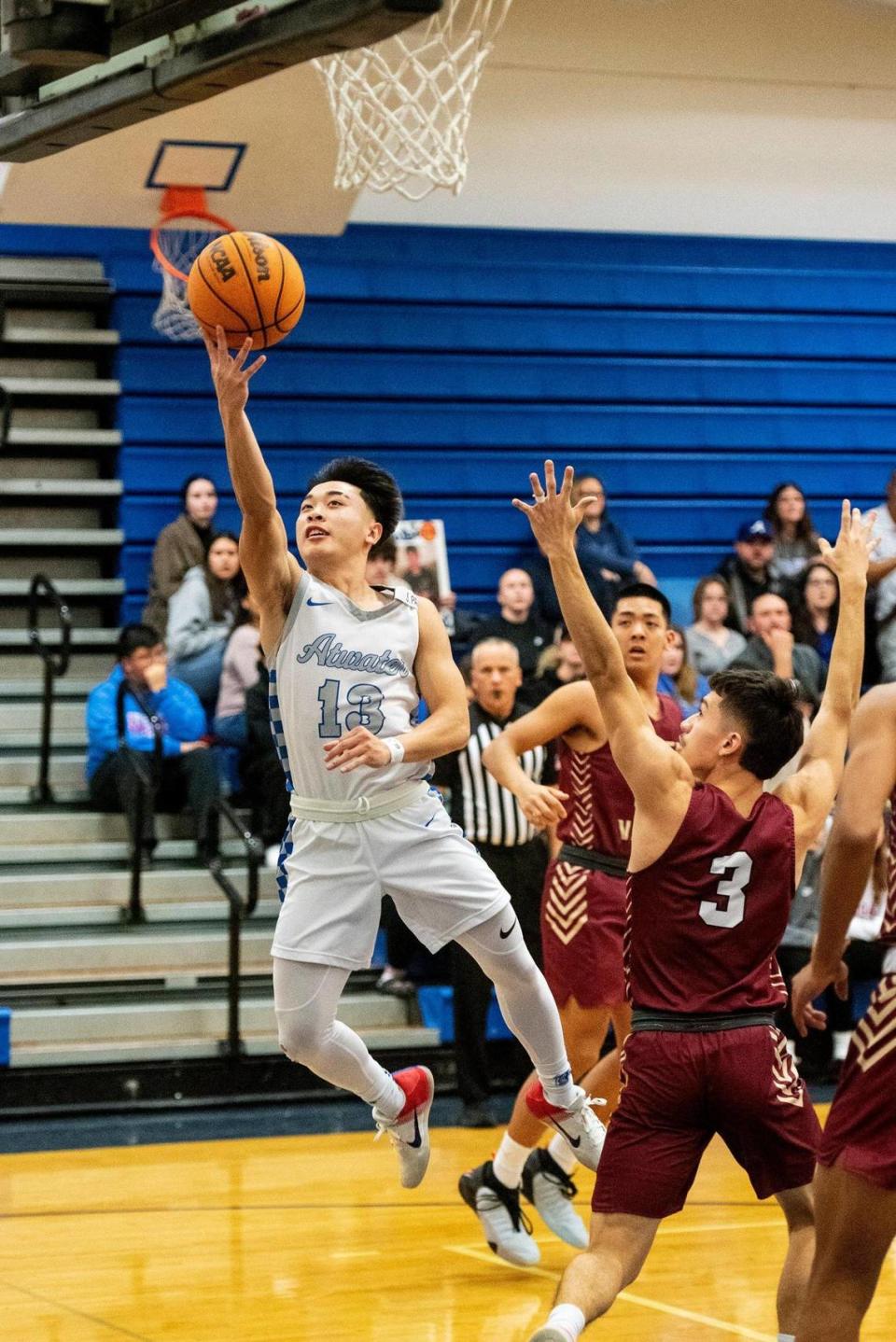 Atwater senior Khoi Nguyen (13) attempts a layup during a game against Golden Valley at Atwater High School in Atwater, Calif., on Monday, Jan. 29, 2024.