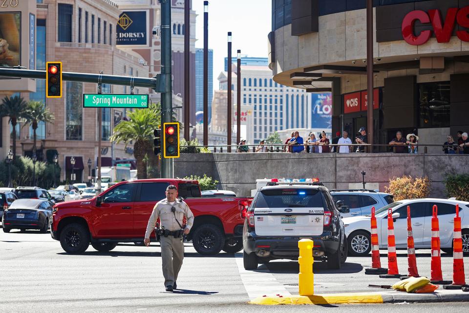 Police work at the scene where multiple people were stabbed in front of a Strip casino in Las Vegas, Thursday, Oct. 6, 2022.