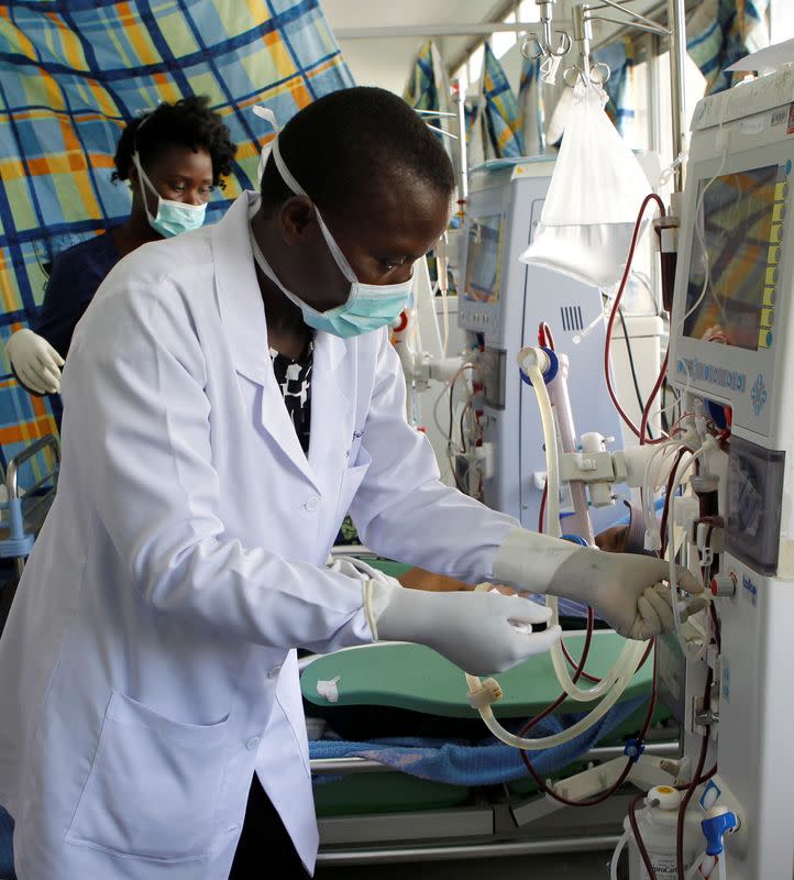 A nurse operates a dialysis machine at the renal unit of the Kenyatta National Hospital in Nairobi
