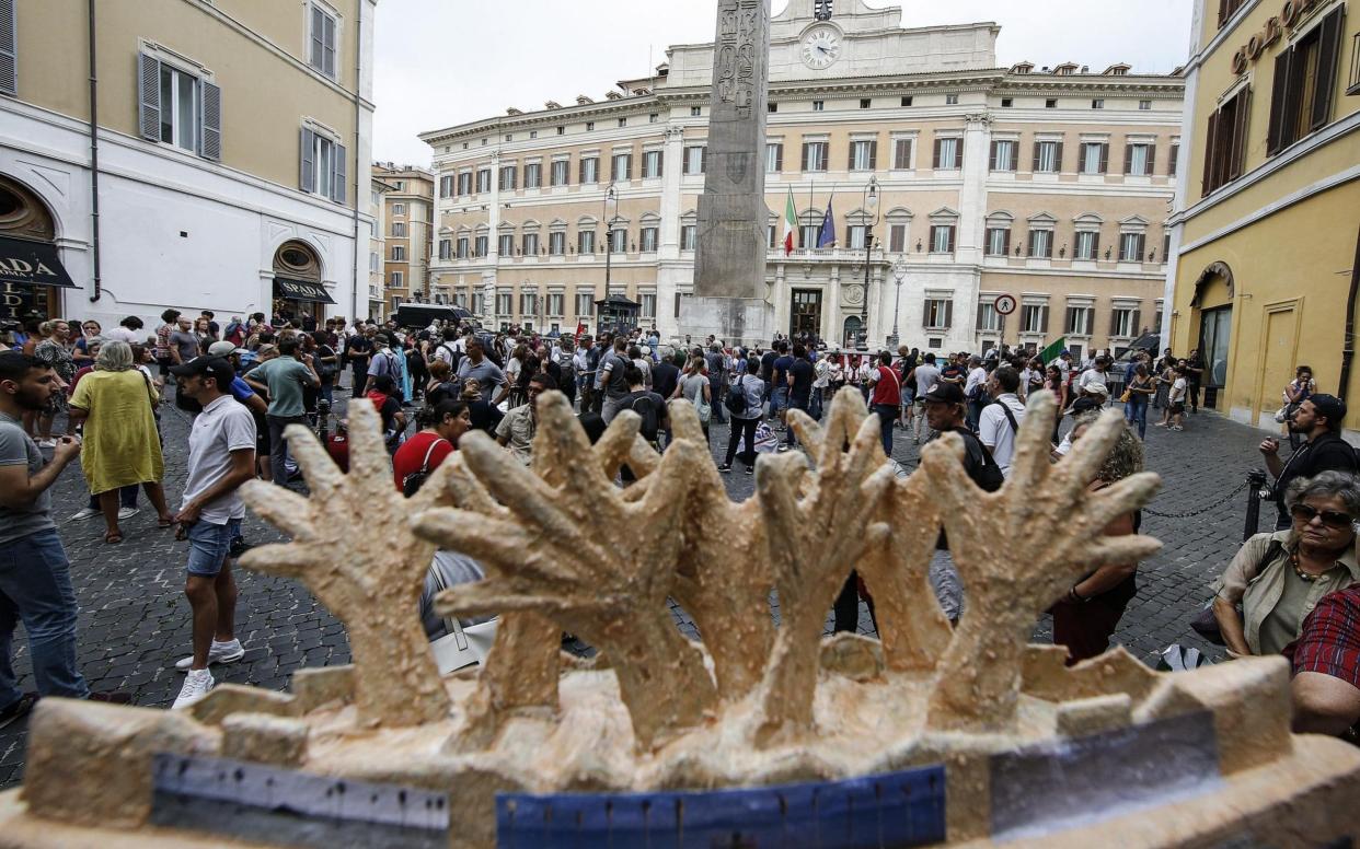 We remain Human activists protest in front of Montecitorio Palace in solidarity with migrants in Rome, Italy, 15 July 2019 - REX