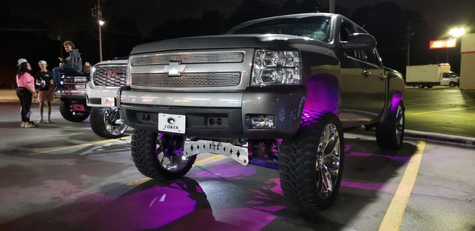 Members of the Stunna Empire truck club meet at the Sonic Drive-In near Hope Mills on Oct. 9. The ‘Carolina Squat’ truck modification is popular among members. Last year, state legislators passed a bill that bans the modification.