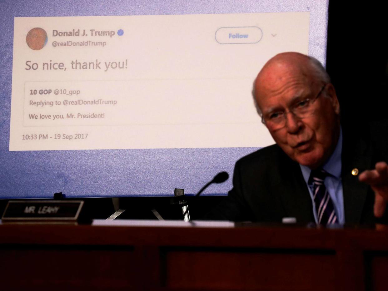 Senator Pat Leahy shows a re-tweet by President Trump of an alleged Russian troll account as representatives of Twitter, Facebook and Google testify before on Capitol Hill on October 31, 2017: REUTERS/Jonathan Ernst