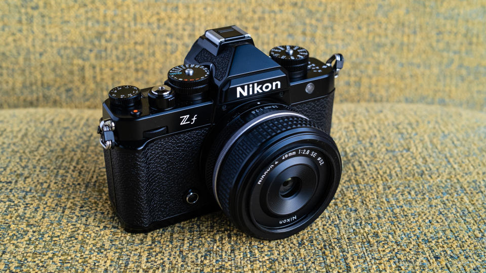 Nikon Z f camera on a vintage-style yellow chair