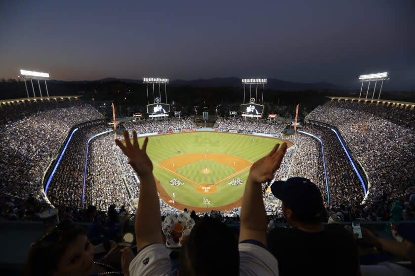 LOS ANGELES, CALIF. --WEDNESDAY, OCT. 25, 2017: Dodgers fans wave souvenir towels.