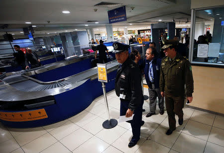 The General of the Chilean Air Force and director of aeronautics Victor Villalobos (L), next to the General of the Police Leonardo Espinoza, inspect the departures area inside the international airport in Santiago, Chile August 16, 2018. REUTERS/Rodrigo Garrido