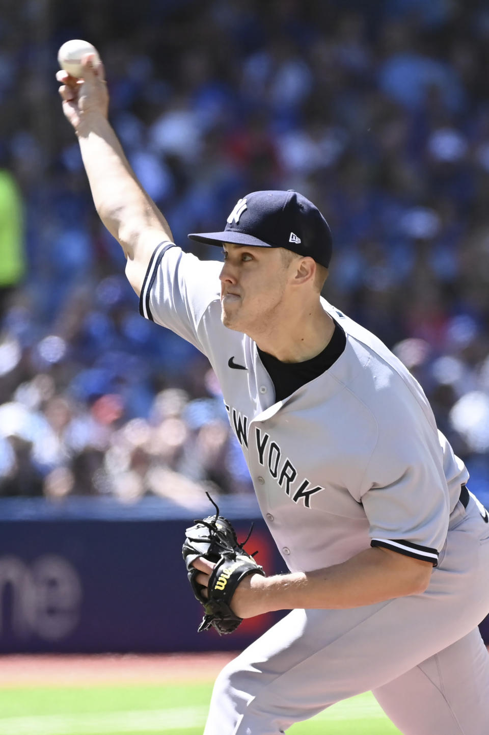 New York Yankees starting pitcher Jameson Taillon throws to a Toronto Blue Jays batter in the first inning of a baseball game in Toronto, Saturday, June 18, 2022. (Jon Blacker/The Canadian Press via AP)