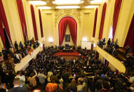 People attend the reading of one of two manifestos defending the nation's democratic institutions and electronic voting system inside the Faculty of Law at Sao Paulo University in Sao Paulo, Brazil, Thursday, Aug. 11, 2022. The two documents are inspired by the original “Letter to the Brazilians” from 1977 denouncing the brutal military dictatorship and calling for a prompt return of the rule of law. (AP Photo/Andre Penner)