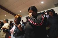 Mourners react during funeral services for 25-year old Freddie Gray, a Baltimore black man who died in police custody, at New Shiloh Baptist Church in Baltimore, Maryland April 27, 2015. Gray's death has led to protests in the latest outcry over U.S. law enforcement's treatment of minorities. Police say he died of a neck injury on April 19 after being arrested on April 12. (REUTERS/Shannon Stapleton)