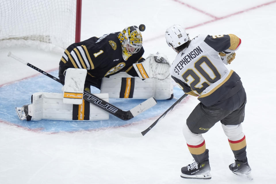 Vegas Golden Knights center Chandler Stephenson (20) scores as Boston Bruins goaltender Jeremy Swayman (1) is unable to stop the puck in the third period of an NHL hockey game, Thursday, Feb. 29, 2024, in Boston. (AP Photo/Steven Senne)