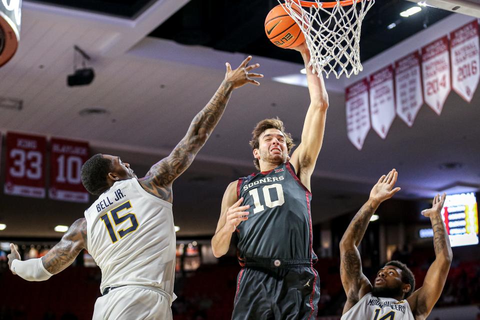 Oklahoma forward Sam Godwin (10) jumps up to score in the first half during a college basketball game between the Oklahoma Sooners (OU) and the West Virginia Mountaineers at Lloyd Noble Center in Norman, Okla., Saturday, Jan. 14, 2023.