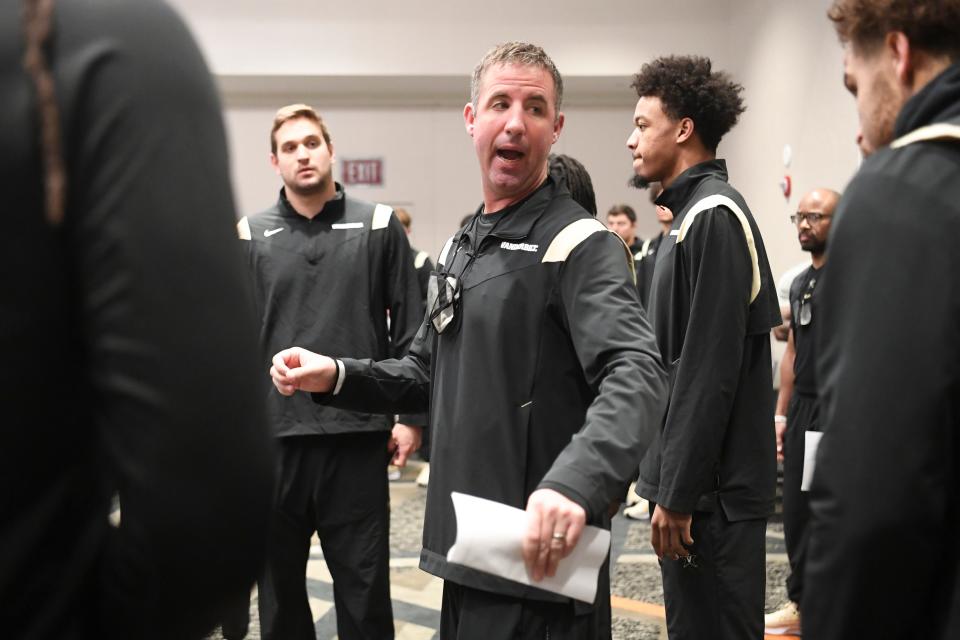 Vanderbilt pass game coordinator Joey Lynch talks to players while walking through offensive plays, Saturday, Nov. 27, 2021.