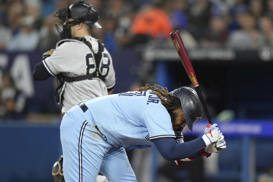 Toronto Blue Jays' Vladimir Guerrero Jr. slams his bat into the dirt after striking out against the New York Yankees during the third inning of a baseball game Thursday, Sept. 28, 2023, in Toronto. (Chris Young/The Canadian Press via AP)
