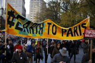 People take part in a protest about climate change around New York City Hall at lower Manhattan, New York, November 29, 2015, a day before the start of the Paris Climate Change Conference (COP21). REUTERS/Eduardo Munoz