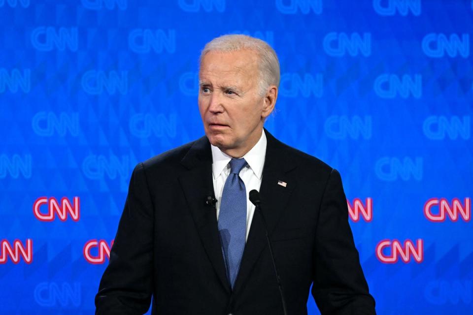 Biden looks on as he participates in the first presidential debate. His mumbling left many wondering if Democrats should put forward a different candidate in November (AFP via Getty Images)