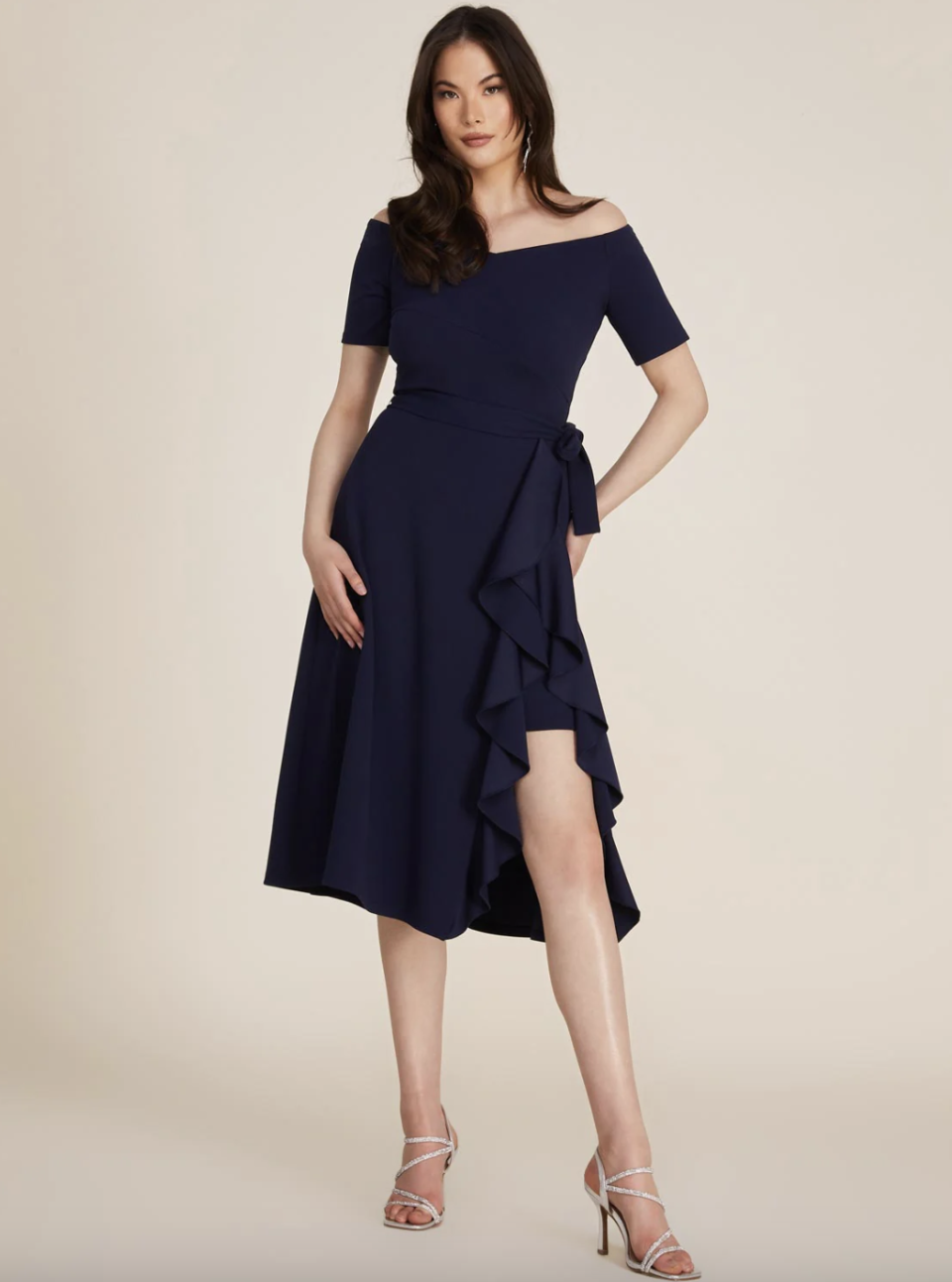 model in navy blue Off-The-Shoulder Wrap Fit & Flare Midi Dress (Photo via Le Château)