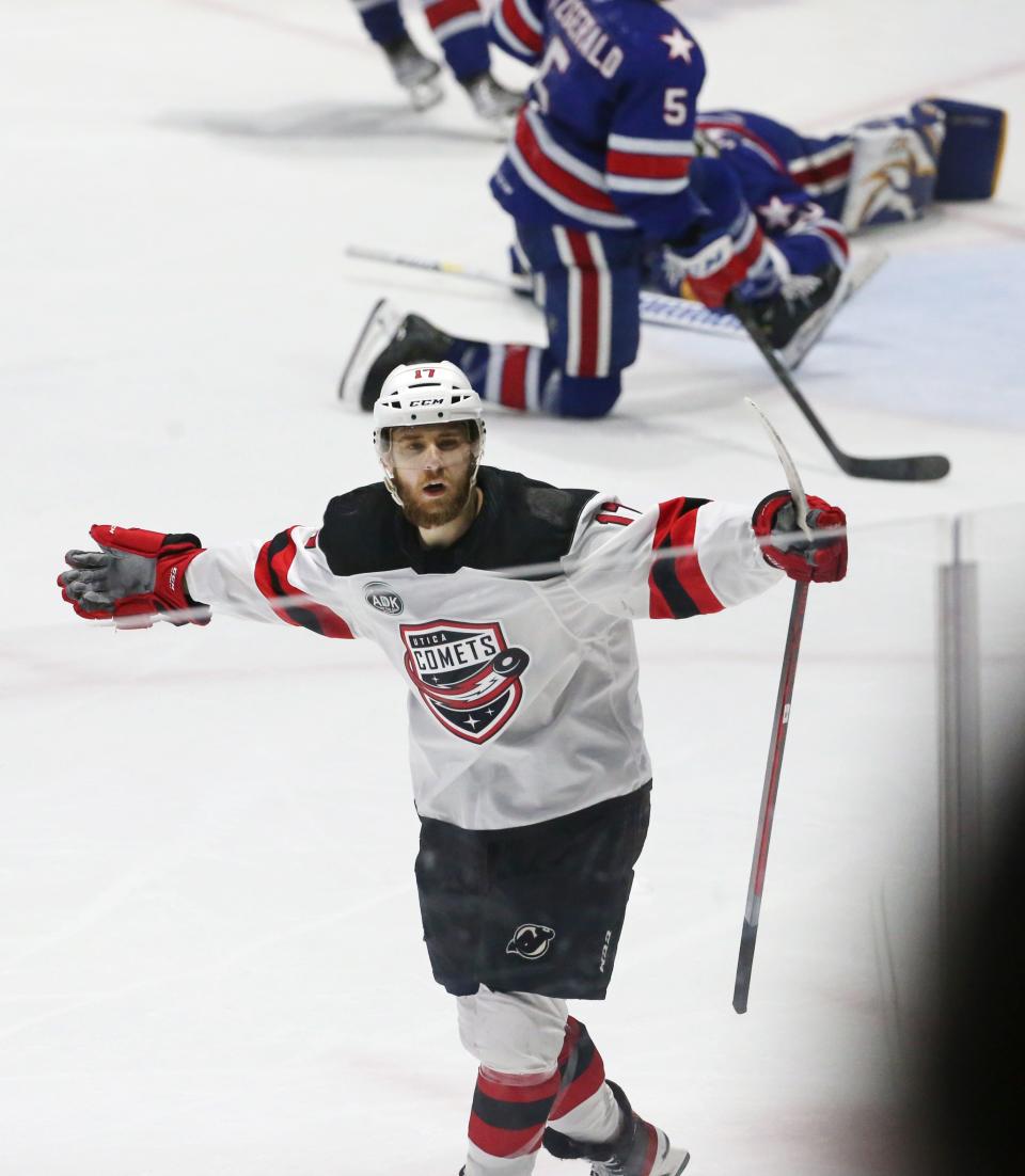 Utica's A.J. Greer celebrates his second period goal during Game 4 of their North Division semifinal series Tuesday, May 17, 2022 at Blue Cross Arena.  Utica won the game 4-2.