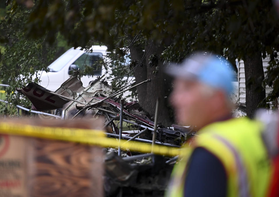 The wreckage of a plane crash is seen, Sunday, Aug. 8, 2021 in Victoria, Minn. Three people died when a single-engine plane crashed into a vacant lot and burst into flames in a small southeastern Minnesota city, a National Transportation Safety Board official said Sunday.(Aaron Lavinsky/Star Tribune via AP)