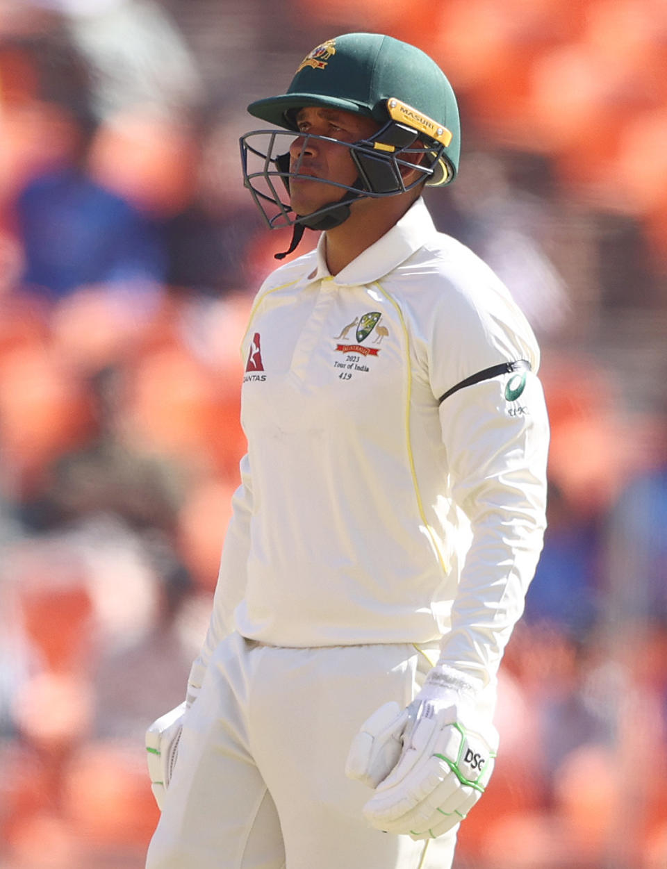 Usman Khawaja, pictured here wearing a black armband as a mark of respect after the death of of Pat Cummins' mother.