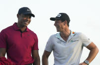 Viktor Hovland, of Norway, right, shares a laugh with Tiger Woods, after winning the Hero World Challenge PGA Tour at the Albany Golf Club in New Providence, Bahamas, Sunday, Dec. 4, 2022. (AP Photo/Fernando Llano)