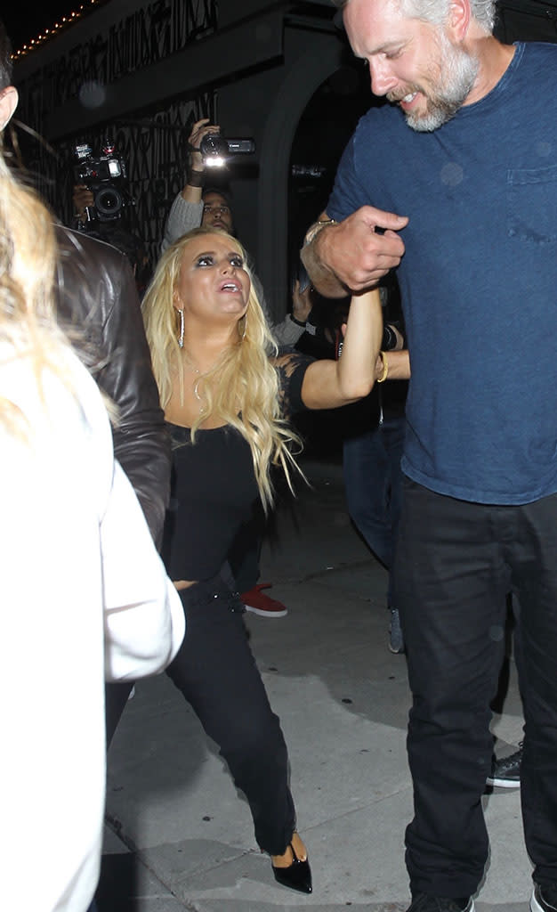 Jessica Simpson is helped into her car by Eric Johnson after leaving Craig's restaurant in West Hollywood on Sept. 20 after a six-hour dinner with friends. 