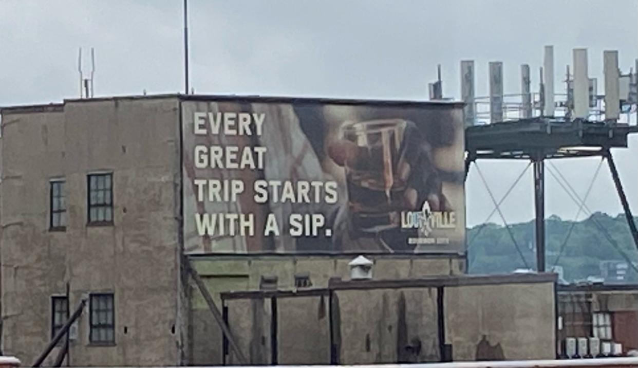 This billboard that reads, “EVERY GREAT TRIP STARTS WITH A SIP,” is aimed at drivers headed east on U.S. Route 50 and those about to cross the Big Mac Bridge into Kentucky.