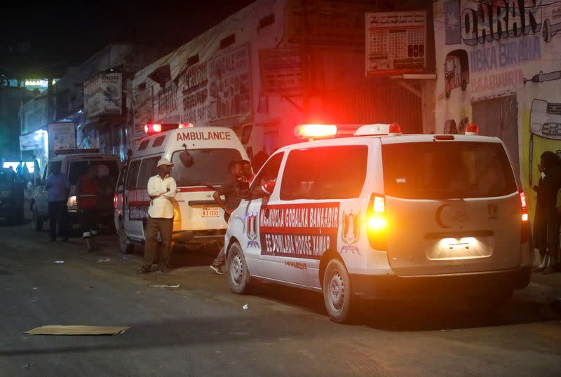 Ambulances are seen near the scene of a car bomb explosion in the Kilometre 4 area of Mogadishu