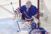 New York Rangers goaltender Igor Shesterkin makes a save against the New Jersey Devils in the second period of Game 3 of the team's NHL hockey Stanley Cup first-round playoff series Saturday, April 22, 2023, in New York. (AP Photo/Adam Hunger)