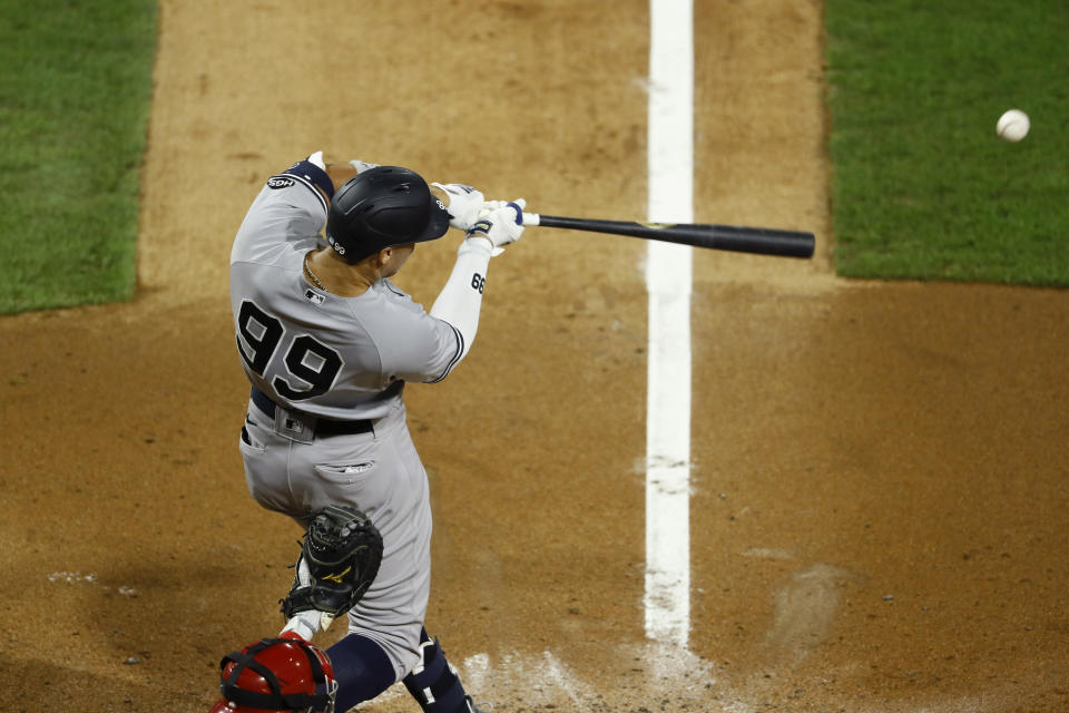 New York Yankees' Aaron Judge hits a single off Philadelphia Phillies starting pitcher Aaron Nola during the fourth inning of the second baseball game in a doubleheader, Wednesday, Aug. 5, 2020, in Philadelphia. (AP Photo/Matt Slocum)