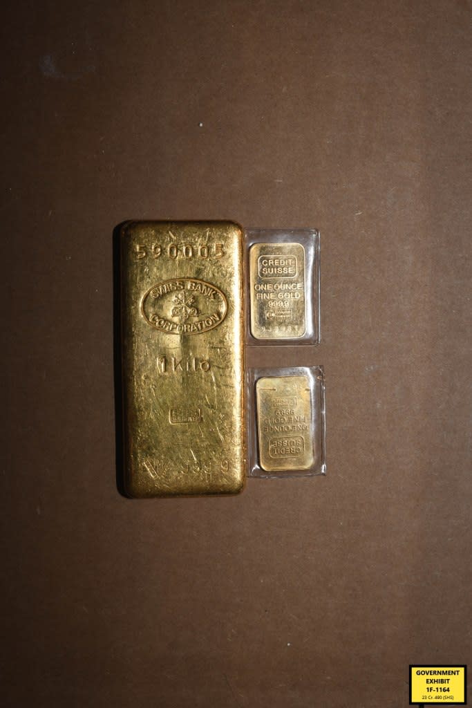 There were large and small gold bars in the home. Some appeared worn while others were still inside clear plastic packaging.