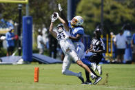 Dallas Cowboys wide receiver Simi Fehoko (81) and Los Angeles Chargers defensive back Ja'Sir Taylor (36) participate in drills during a combined NFL practice at the Los Angeles Rams' practice facility in Costa Mesa, Calif. Wednesday, Aug. 17, 2022. (AP Photo/Ashley Landis)