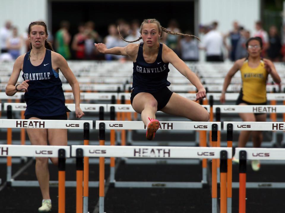 Granville's Ayla Cook leads the Buckeye Division 100 hurdles during the Licking County League championships at Heath on Friday, May 10, 2024.