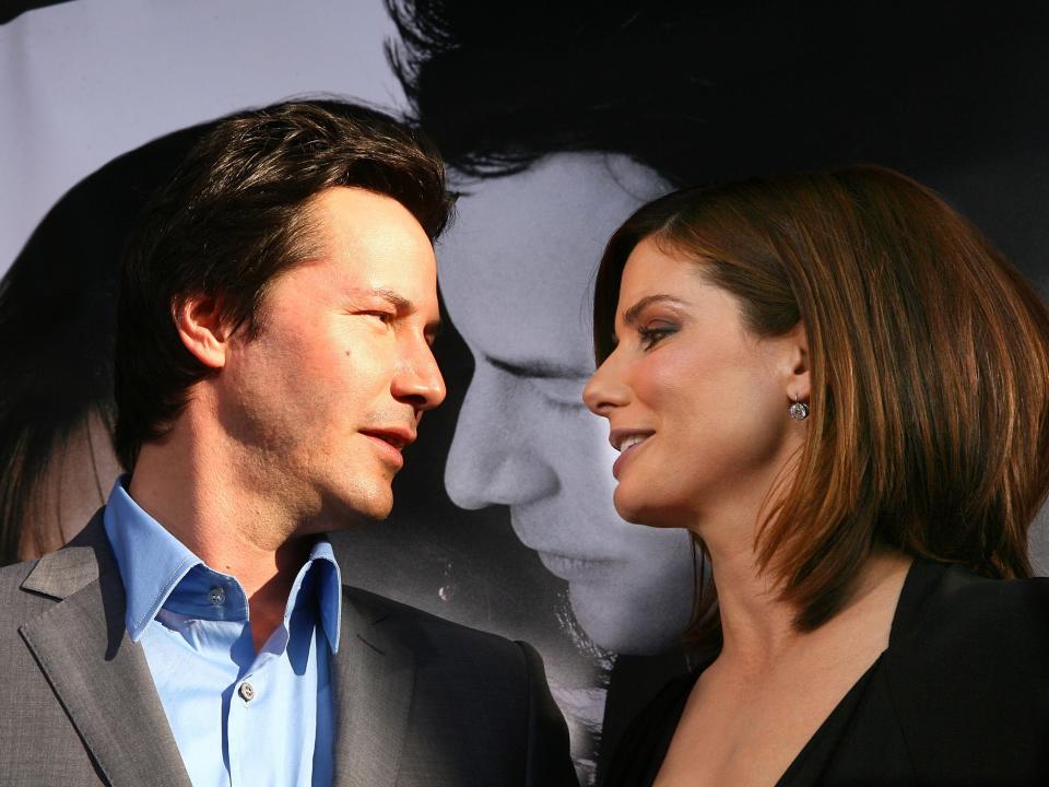 JUNE 13: Actors Keanu Reeves (L) and Sandra Bullock arrive at the premiere of Warner Bros. Pictures' "The Lake House" at the Cinerama Dome on June 13, 2006 in Los Angeles, California. (