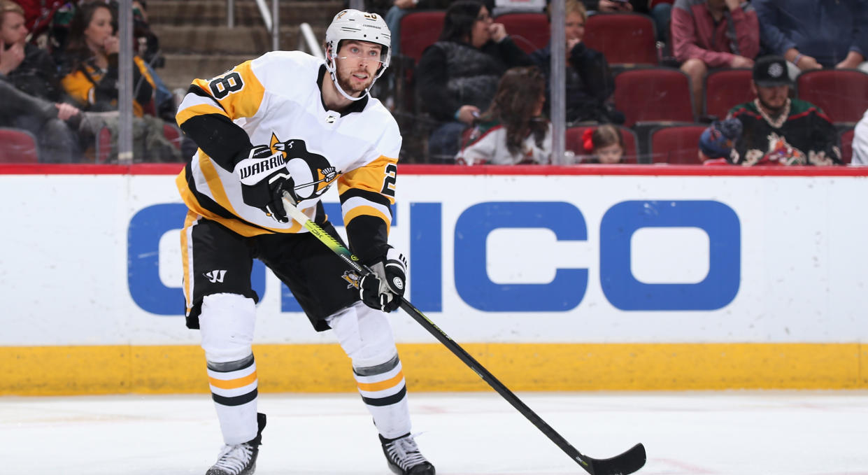 GLENDALE, ARIZONA - JANUARY 12: Marcus Pettersson #28 of the Pittsburgh Penguins passes the puck against the Arizona Coyotes during the NHL game at Gila River Arena on January 12, 2020 in Glendale, Arizona. The Penguins defeated the Coyotes 4-3 in an overtime shootout. (Photo by Christian Petersen/Getty Images)