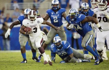 Josh Robinson breaks away from the Kentucky defense for a touchdown run. (AP photo)