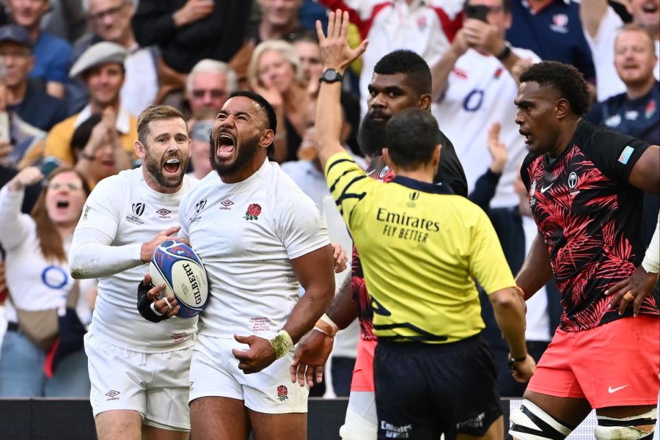 Manu Tuilagi powered over for England’s first try (Getty)