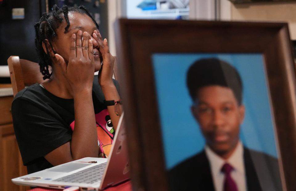 July 8, 2022; Reynoldsburg, Ohio;The Turner family lost their son, Lamont Turner, pictured, to suicide in 2019 after he was sexually abused by his doctor. His sister Shawana Turner, left, wipes her tears as she watches a video of Lamont giving a speech about Black history at his church, Summit on 16th United Methodist Church. Fred Squillante-The Columbus Dispatch