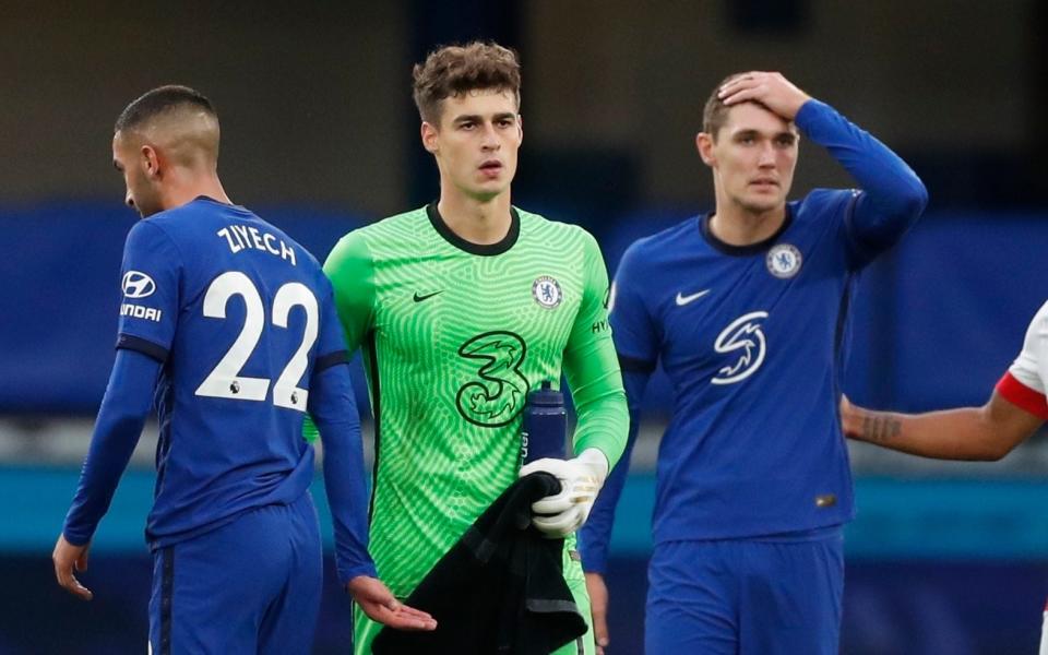 Kepa Arrizabalaga (centre) and Andreas Christensen (right) appear dejected - REUTERS