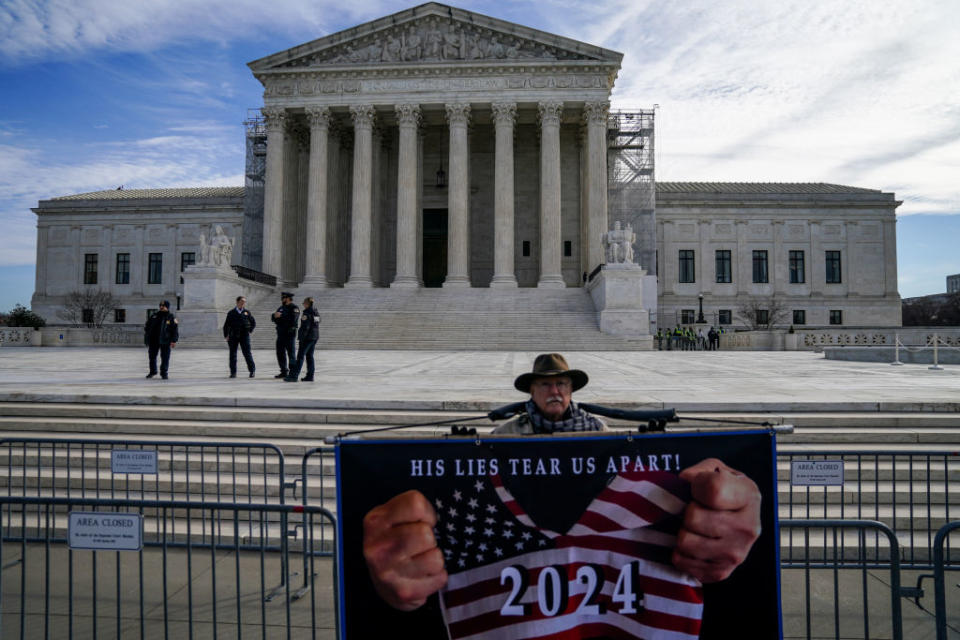 Demonstrators call for Donald Trump to be kept off of the presidential primary ballot outside the U.S. Supreme Court on February 8, 2024, in Washington, D.C. (Photo by Jahi Chikwendiu/The Washington Post via Getty Images)