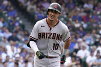 Arizona Diamondbacks' Josh Rojas smiles as he rounds the bases after hitting a solo home run during the seventh inning of a baseball game against the Chicago Cubs in Chicago, Friday, May 20, 2022. (AP Photo/Nam Y. Huh)