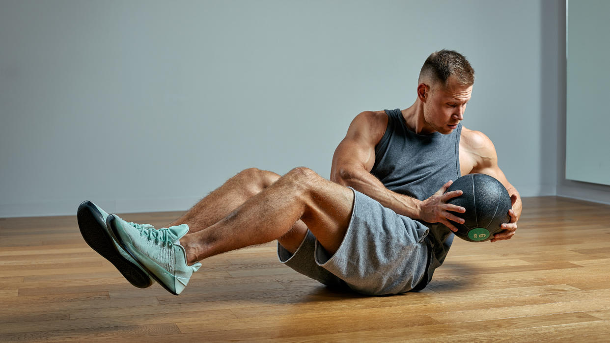  Man performing Russian twists 