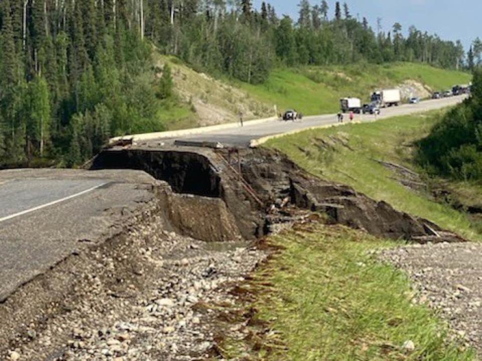 The washout that has closed the Alaska Highway over the holiday weekend. On Monday, a 3-kilometre detour around the site was opened to traffic. (Yukon Highways and Public Works/ Twitter - image credit)