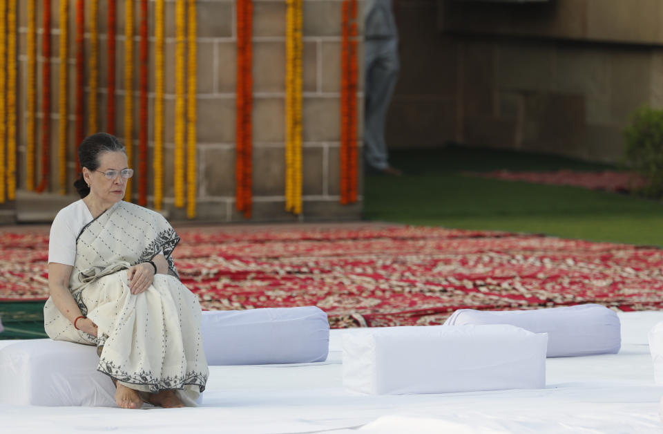 FILE - In this Wednesday, Oct. 2, 2019, file photo, India's main opposition Congress party leader Sonia Gandhi pays tribute to iconic independence leader Mahatma Gandhi on the 150th anniversary of his birth at Rajghat, the Gandhi memorial in New Delhi, India. The current state of India’s main opposition Congress party is so dire, a senior party leader says it is losing so many members and support it may not be able to win upcoming state elections or ensure its own future. Party president Rahul Gandhi left after the May defeat in the general elections. His mother, Sonia Gandhi, stepped in on an interim basis. (AP Photo/Manish Swarup)