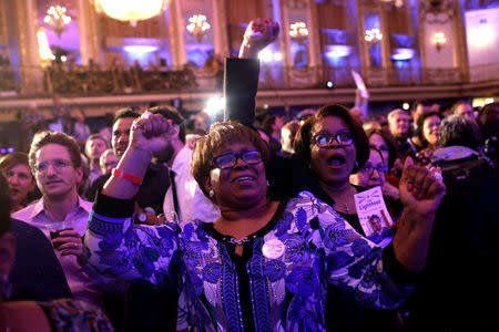 Supporters celebrate mayoral candidate Lori Lightfoot's early election results at her election night celebration during a runoff election with challenger Toni Preckwinkle in Chicago, Illinois, U.S., April 2, 2019. REUTERS/Joshua Lott