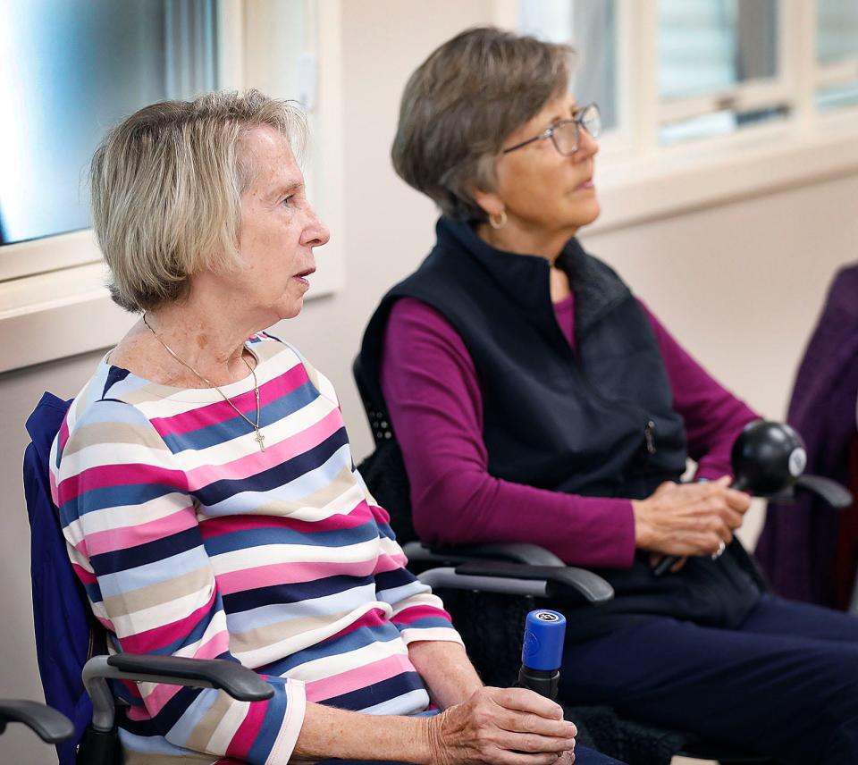Kathy Phillips and Eleonore Alvarez play hand bells as music therapist Rachel Davis, of Sing Explore Create in Rockland, works with seniors at the Milton Senior Center, part of a new six-week music and wellness course called "Let's Make Music,"  on Wednesday, Oct. 5, 2022.