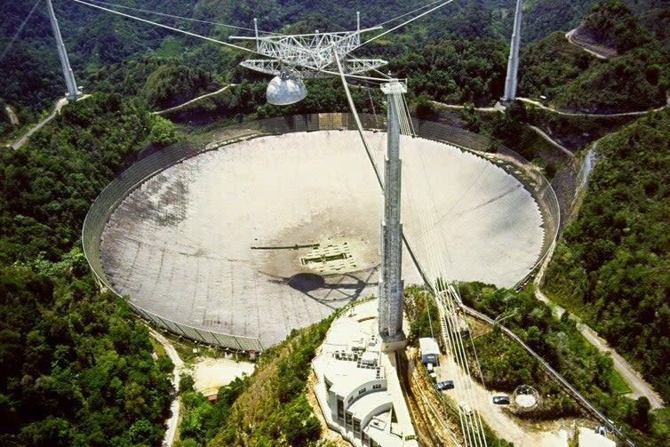 The Arecibo Radio Telescope, at Arecibo, Puerto Rico (H. Schweiker/WIYN and NOAO/AURA/NSF.)