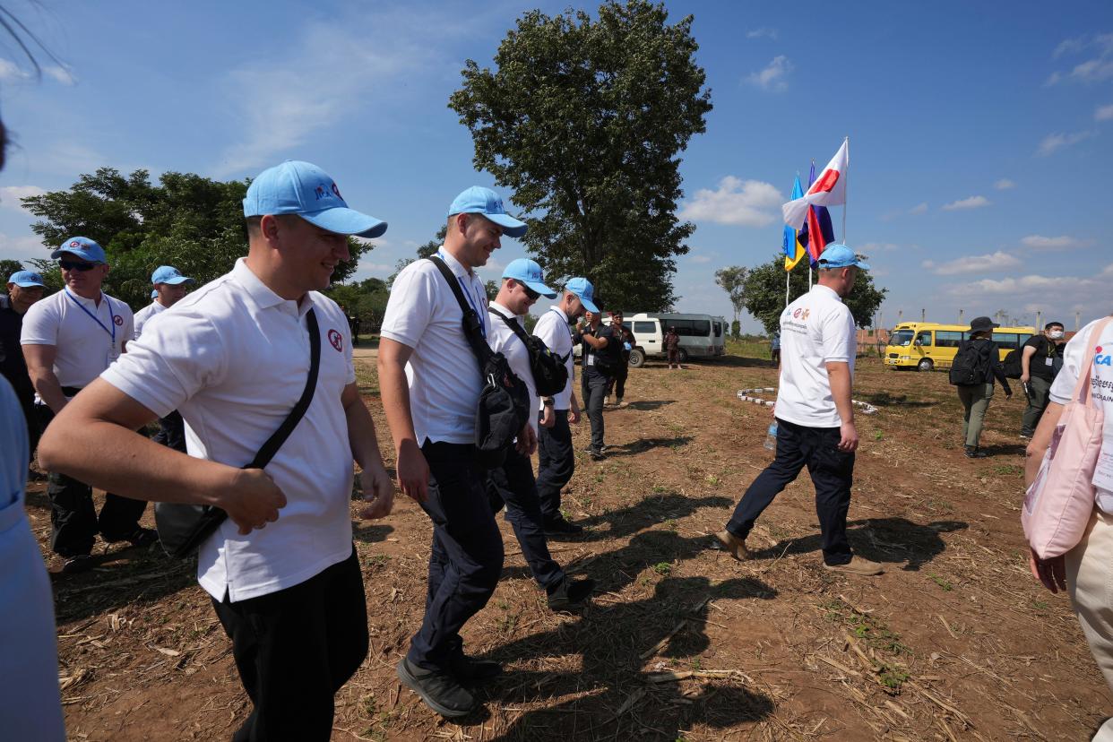Ukrainian deminers arrive at a minefield for a training in Preytotoeung village, Battambang province, Cambodia, (Copyright 2023 The Associated Press. All rights reserved.)